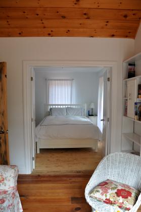 The North bedroom has a queen size bed with custom draperies and top quality bedding.