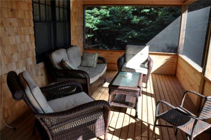 The beautiful screened porch is perfect for morning coffee, and viewing the abundant birdlife.