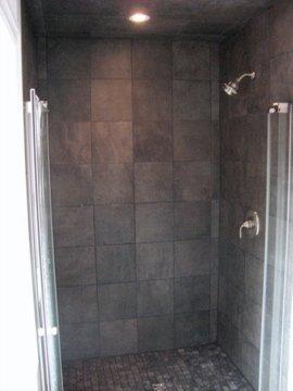 The ensuite bath has a beautiful walk-in granite shower.